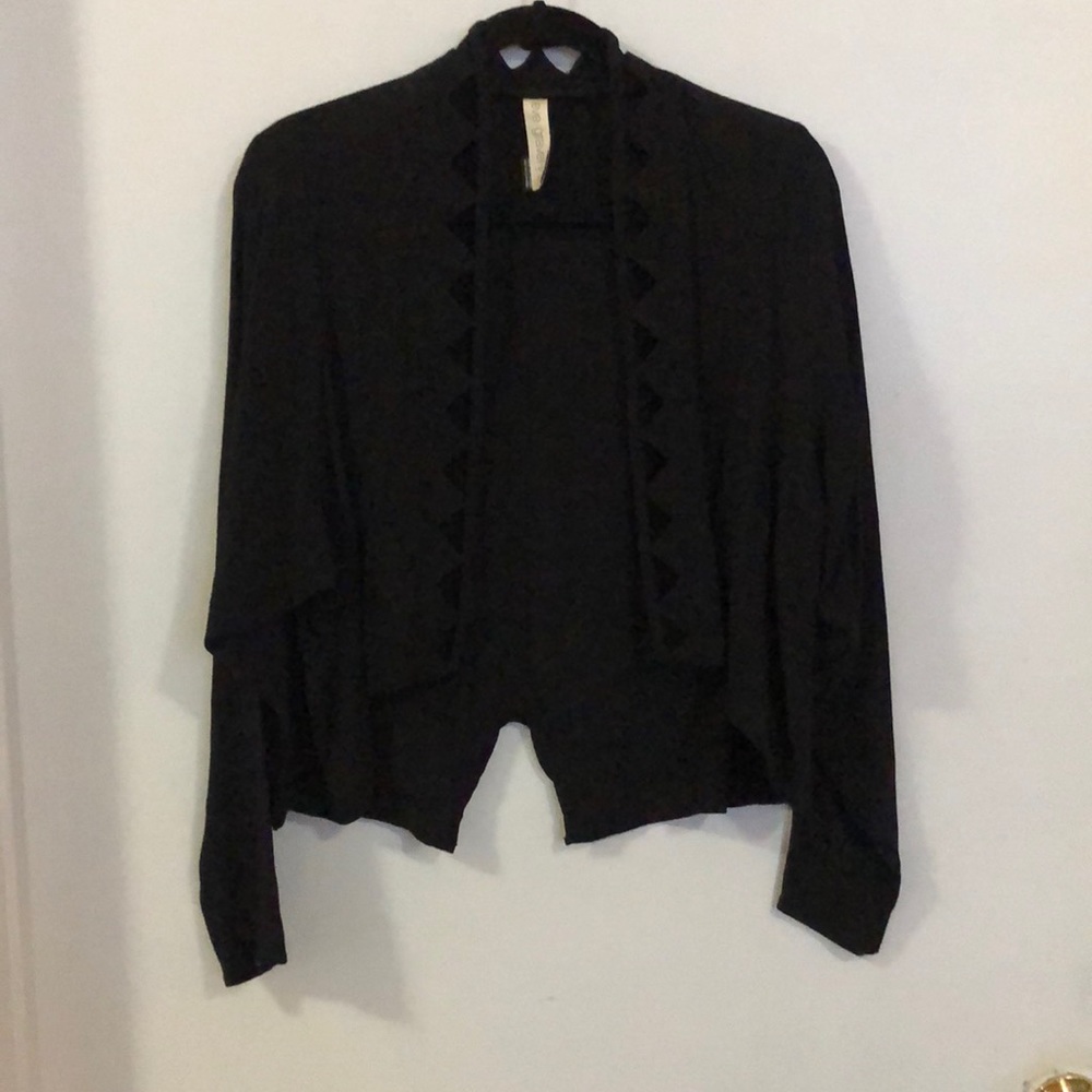 Open front cardigan with diamond cut outs.